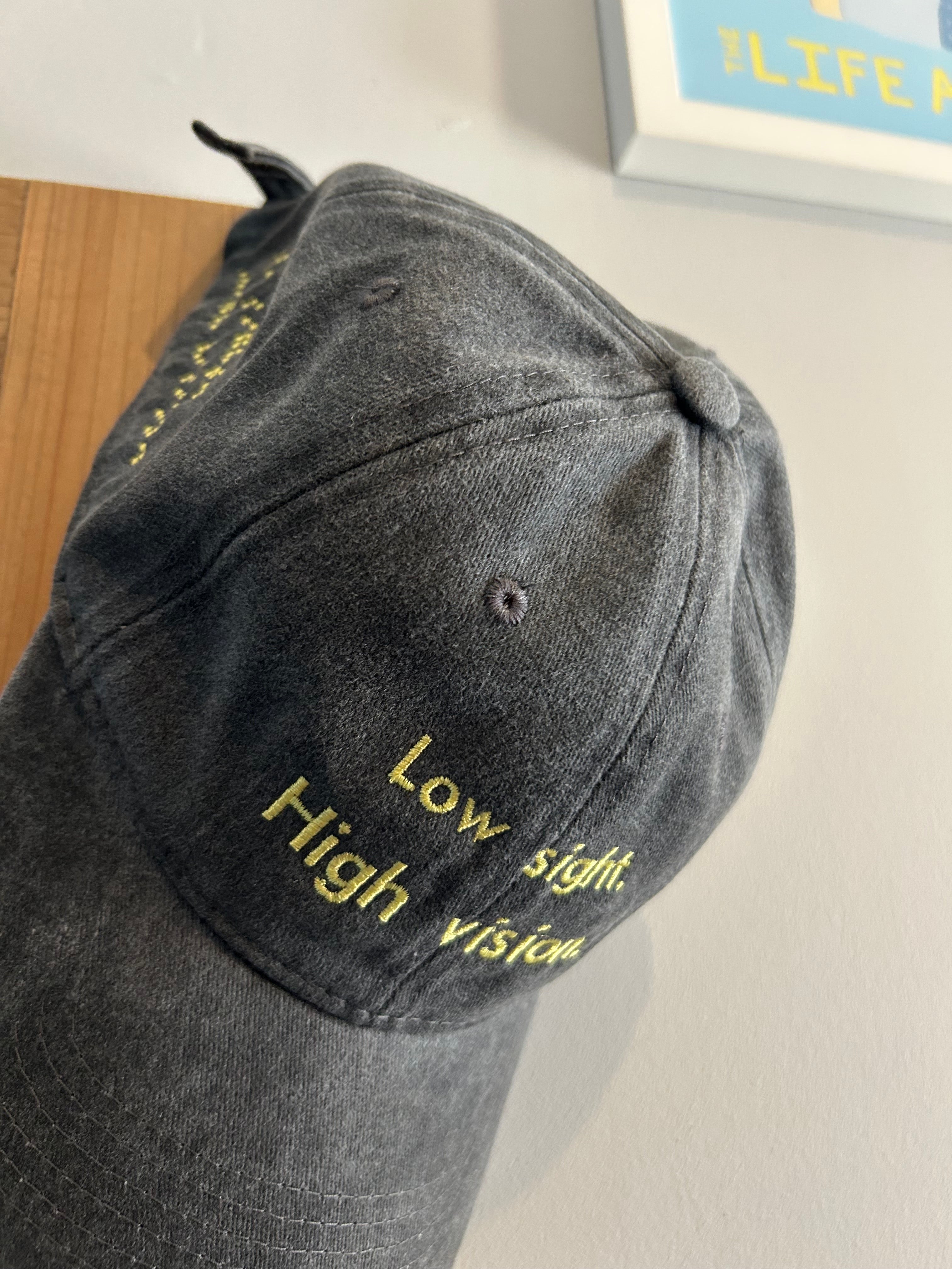 Low sight. High vision. Washed cotton cap in black and yellow.