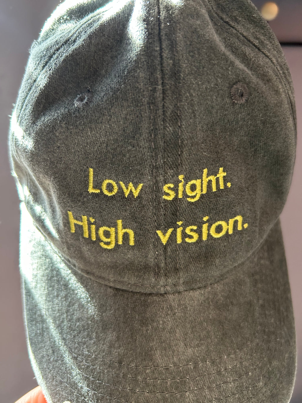 Low sight. High vision. Washed cotton cap in black and yellow.