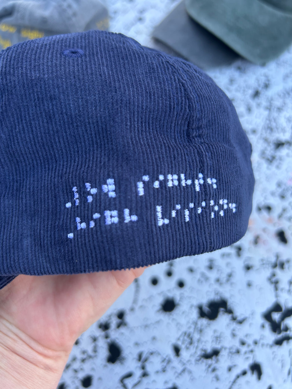 Low sight. High vision.  Navy cord 100% cotton cap with white embroidery