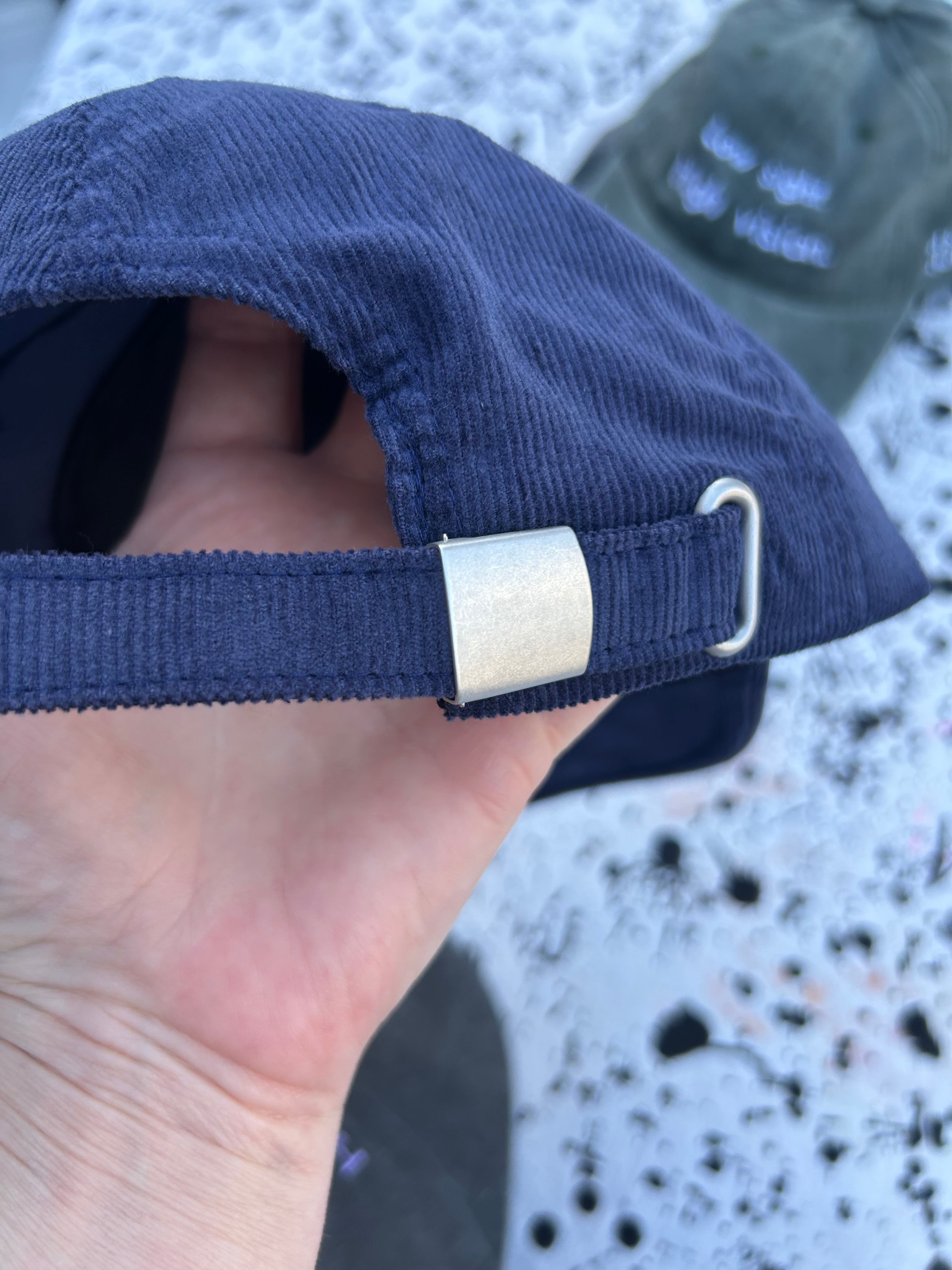 Low sight. High vision.  Navy cord 100% cotton cap with white embroidery