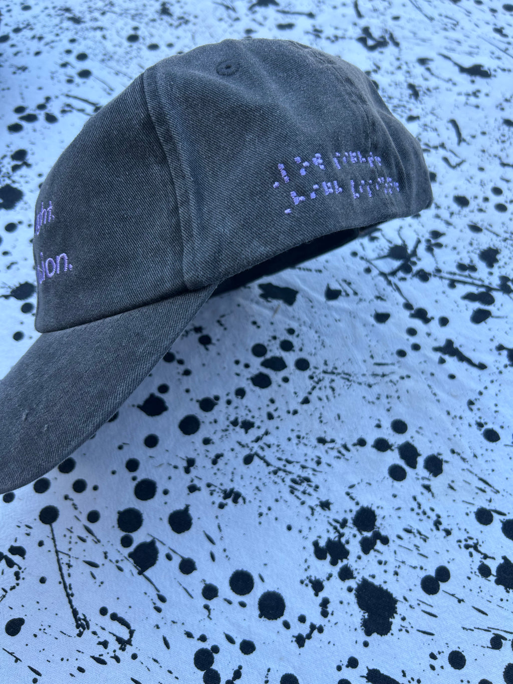 Low sight. High vision. Black and lavender 100% cotton cap.