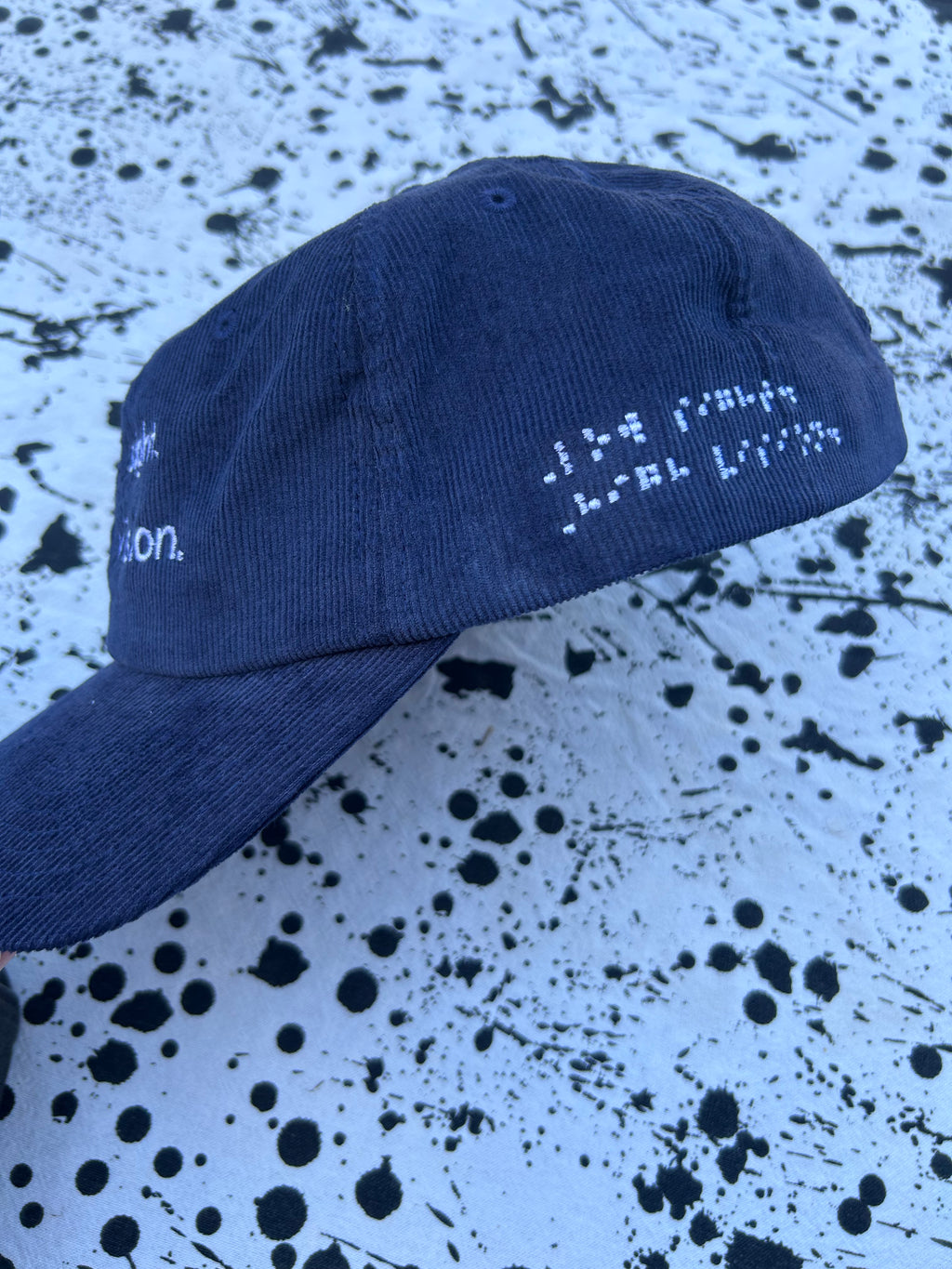 Low sight. High vision.  Navy cord 100% cotton cap with white embroidery