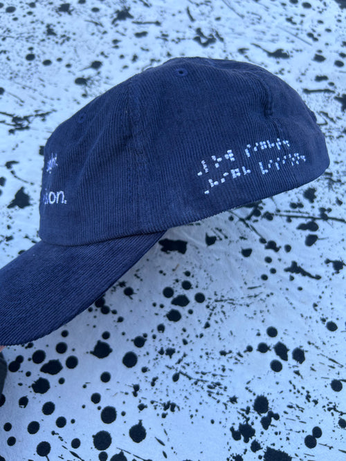 Low sight. High vision.  Navy cord 100% cotton cap with white embroidery