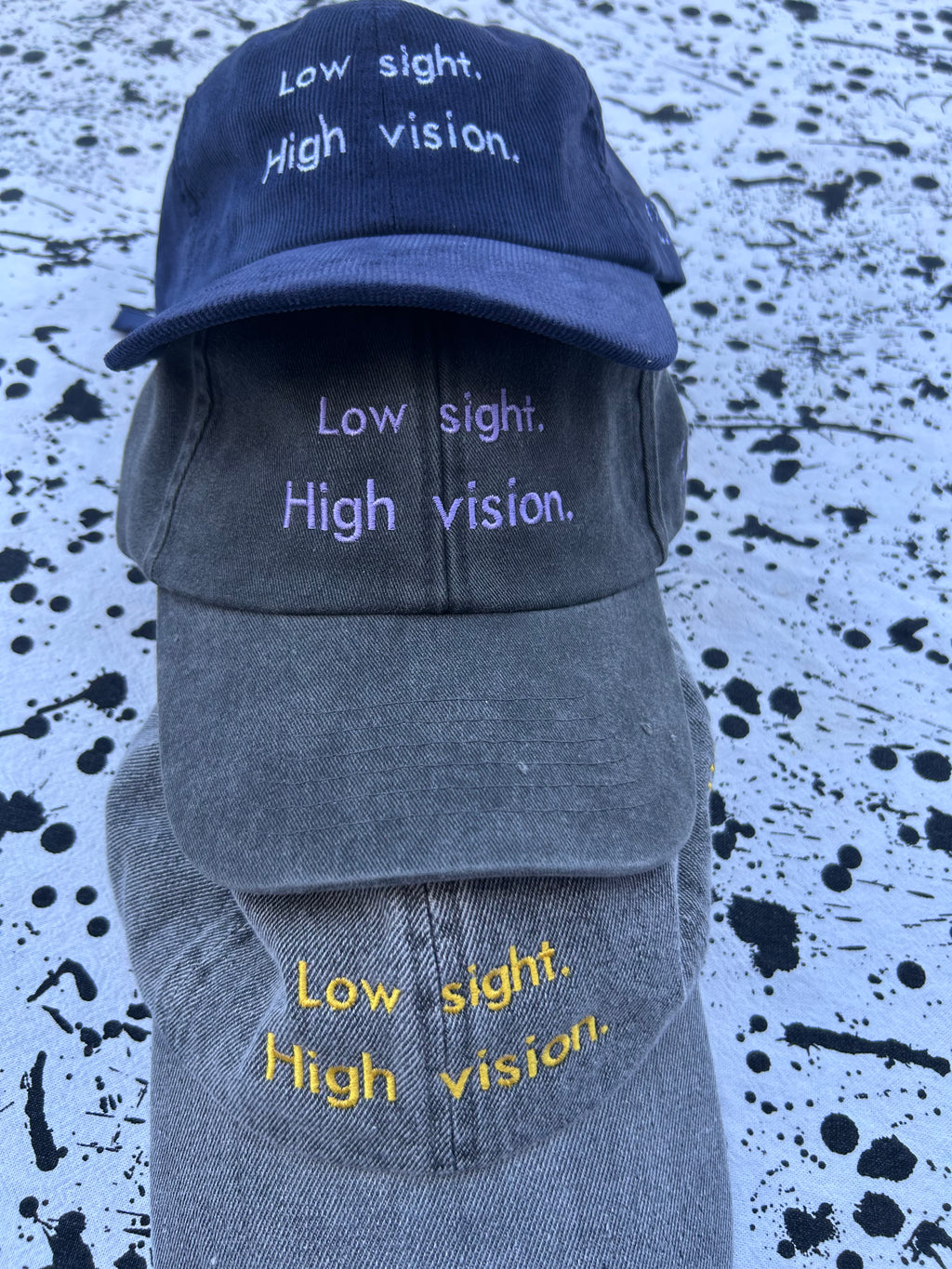 Low sight. High vision. Black and lavender 100% cotton cap.