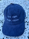 Low sight. High vision.  Navy cord 100% cotton cap with white embroidery